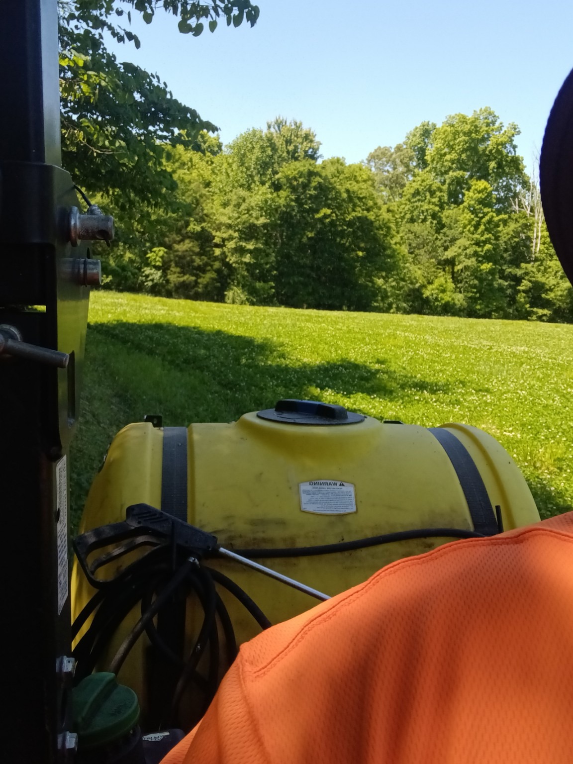 Tractor sprayer working in a field