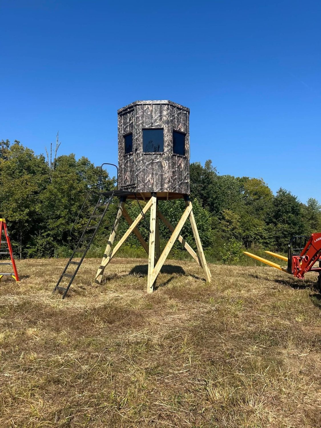 Elevated shooting house installed in a field